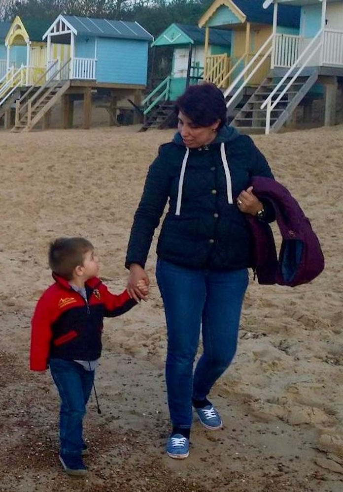 Cartoon image of a mother holding a baby lovingly